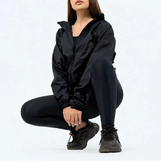 Person wearing a black outfit on a white background