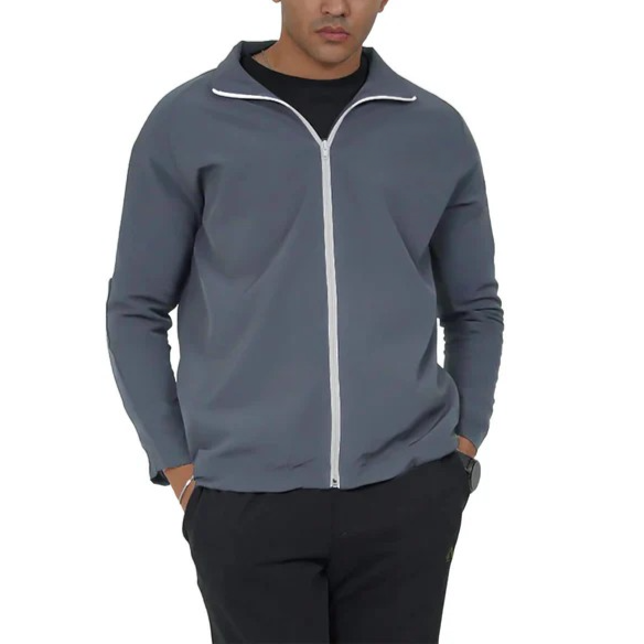 Man wearing a gray jacket with a white zipper on a white background