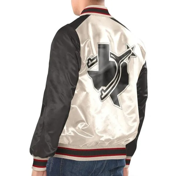 White and black varsity jacket with a large logo on the back, worn by a person.