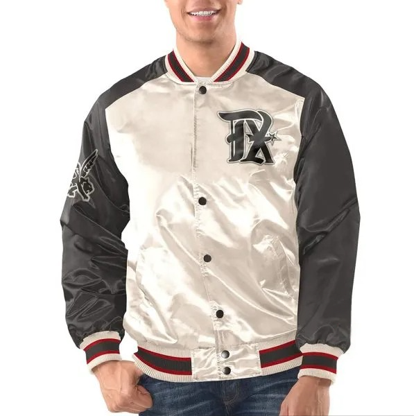 Person wearing a white and black varsity jacket with a logo on a white background