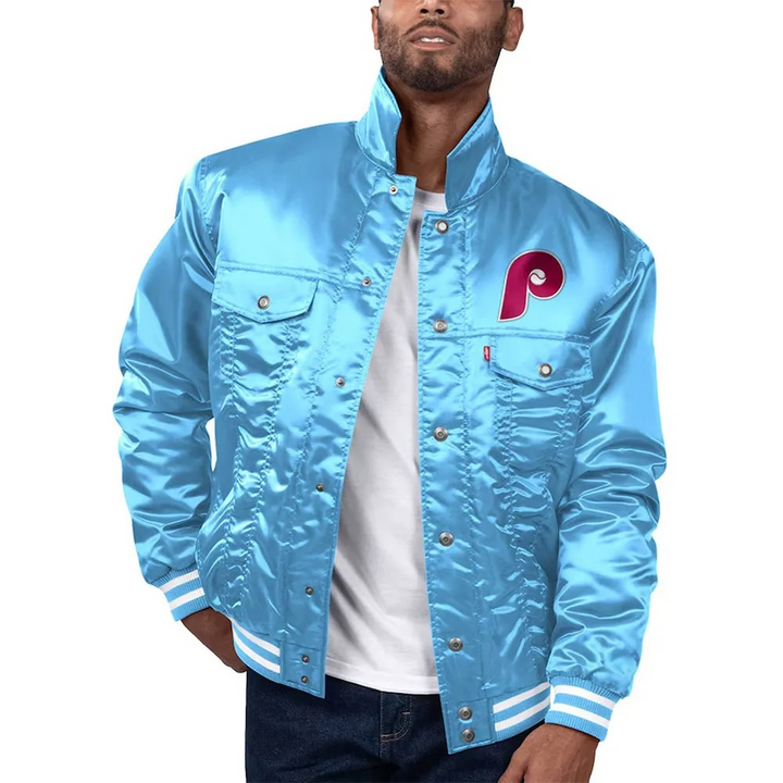 Man wearing a light blue jacket with a red logo on a white background in USA