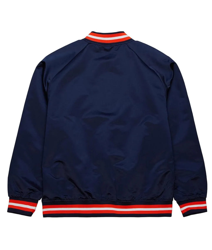 Navy blue jacket with red and white accents on a white background