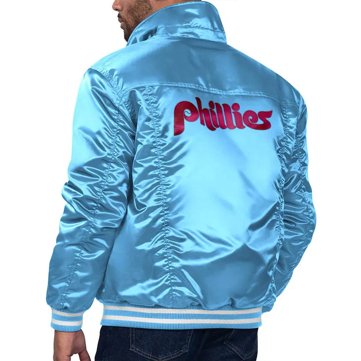 Blue satin jacket with 'Phillies' logo on the back, worn by a person in USA