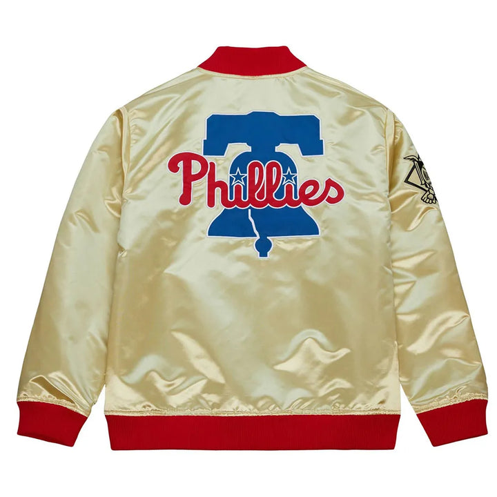 Beige jacket with Phillies logo on the back, red cuffs and collar, on a white background in USA