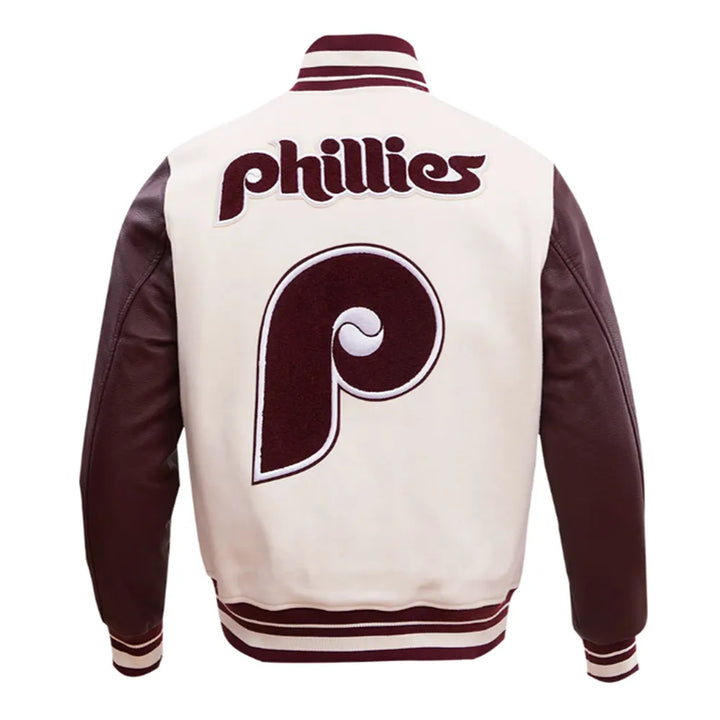 Varsity jacket with 'Phillies' logo on the back, featuring a maroon and white color scheme in UK