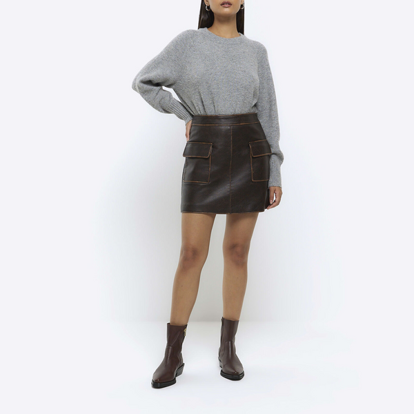 River Island brown faux leather mini skirt front view in USA