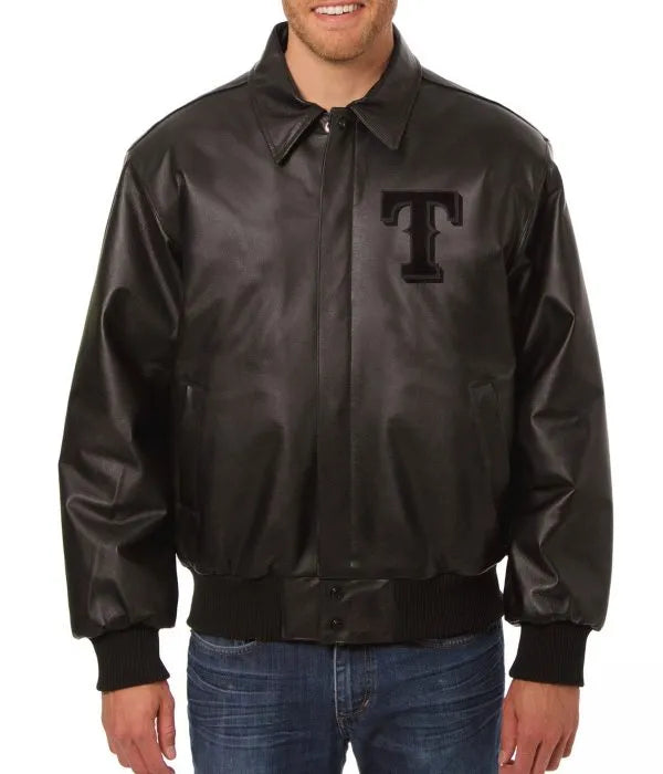 Man wearing a black leather jacket with a logo on a white background in USA