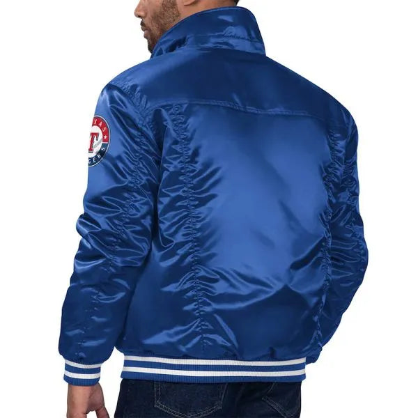 Blue satin jacket with a logo on the sleeve against a white background