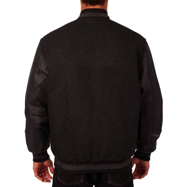 Black jacket worn by a person on a white background