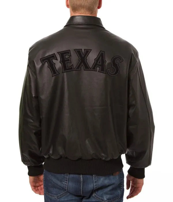 Black leather jacket with 'TEXAS' on the back, worn by a person. in American Style